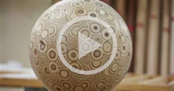 Guy makes a big ball out of plywood