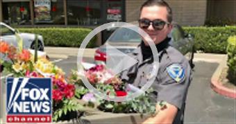 Officers deliver Mother's Day flowers after delive