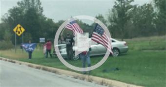 Protestors line streets in advance of President Bi